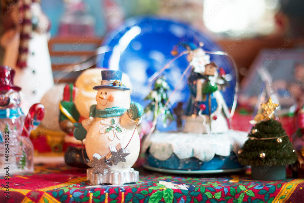 Christmas crystal ball with Santa Claus on the table, decorated in New Year.