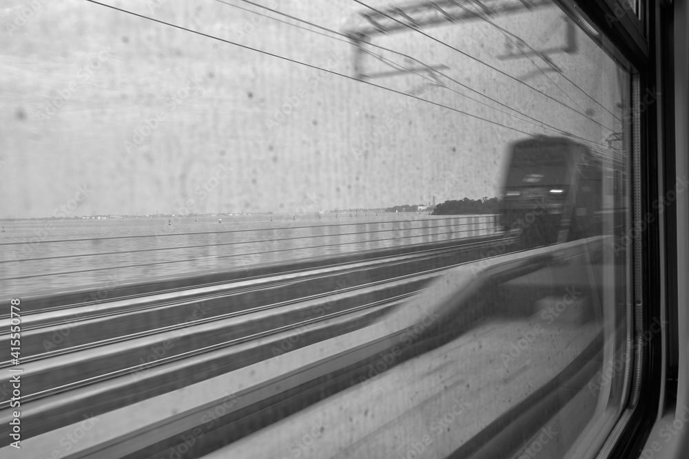 moving train seen from the window of another train