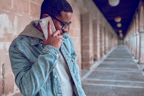 black man talking on mobile phone