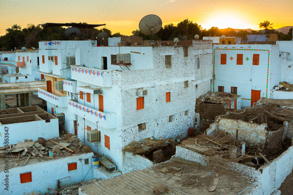 Fototapeta premium Colourful exterior wall of a Nubian house in Egypt. Typical African village houses facade. Medieval street.