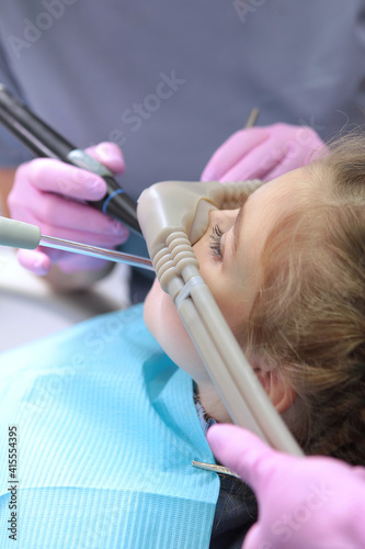 Dental treatment in a child with the use of nitrous oxide. Relaxation of the patient before surgical or dental procedures. Children's modern dentistry. The concept of healthcare.