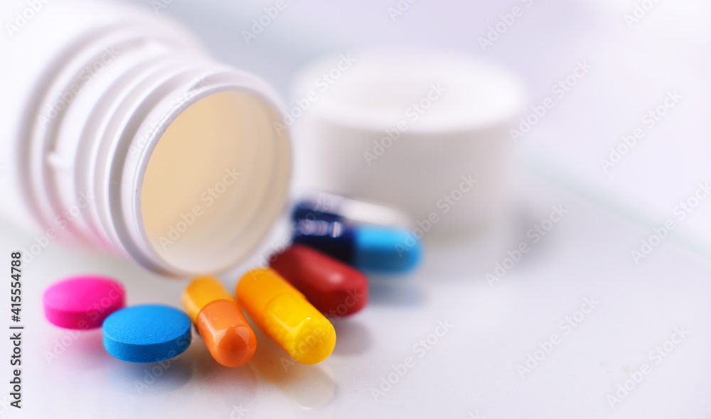 Composition with variety of drug pills and container