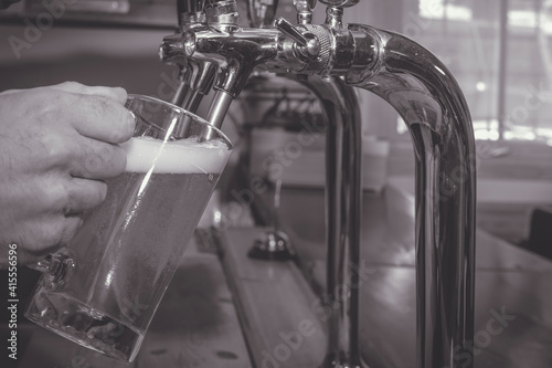 b&w beer pouring
