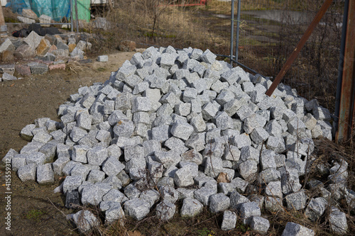 A pile of granite stones for construction.