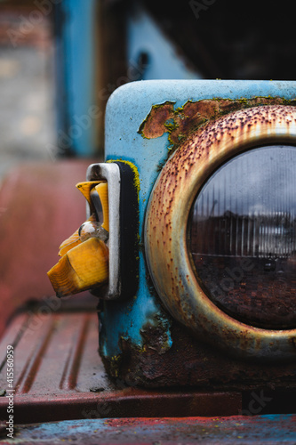 detail of an old rusty truck with broken turn signal
