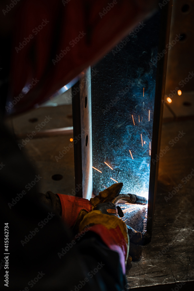 Welder working in the workshop Welder working in the workshop