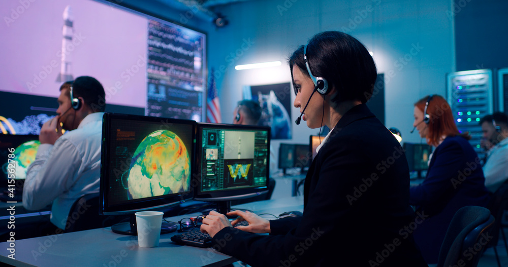 Flight operator using computer during spacecraft launch