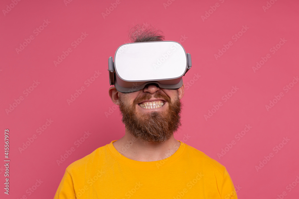 Positive fun happy man in vr glasses on studio background Positive fun happy man in vr glasses on studio background