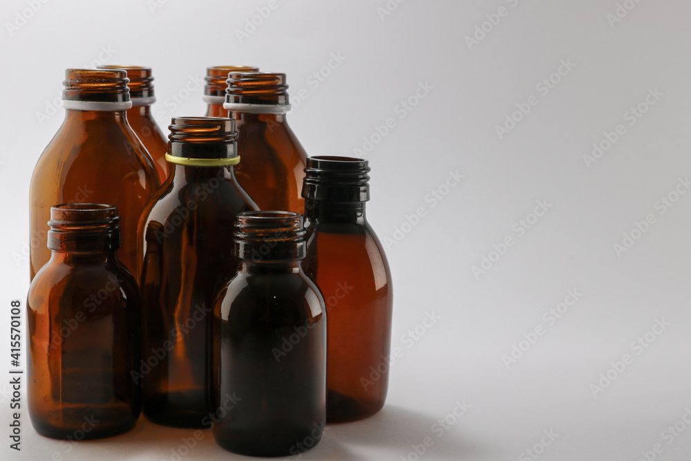 Capless brown bottles of medidcine