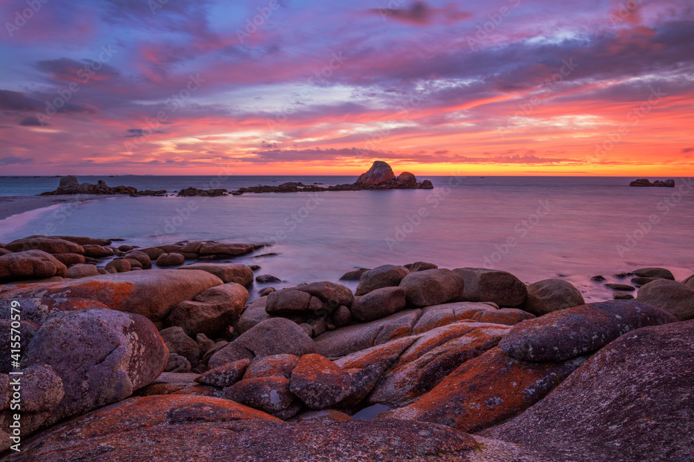 Beautiful, colourful ,autumn sunrise over Picnic Rocks. Mount William National Park. Part of the Bay of Fires Conservation Area. North Eastern Tasmania, Australia.