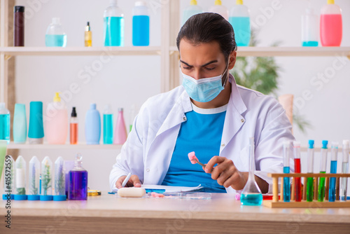 Young male chemist testing soap in the lab