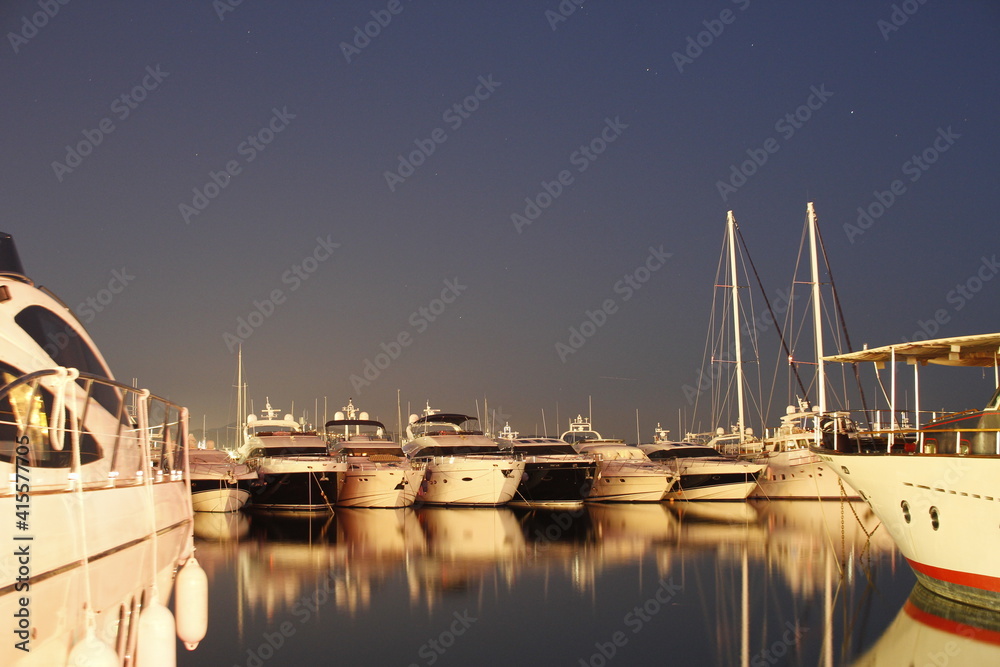 Luxury yachts and motor boats moored in Puerto Banus marina in Marbella, Spain. Marbella is a popular holiday destination located on the Costa del Sol in the southern Andalusia