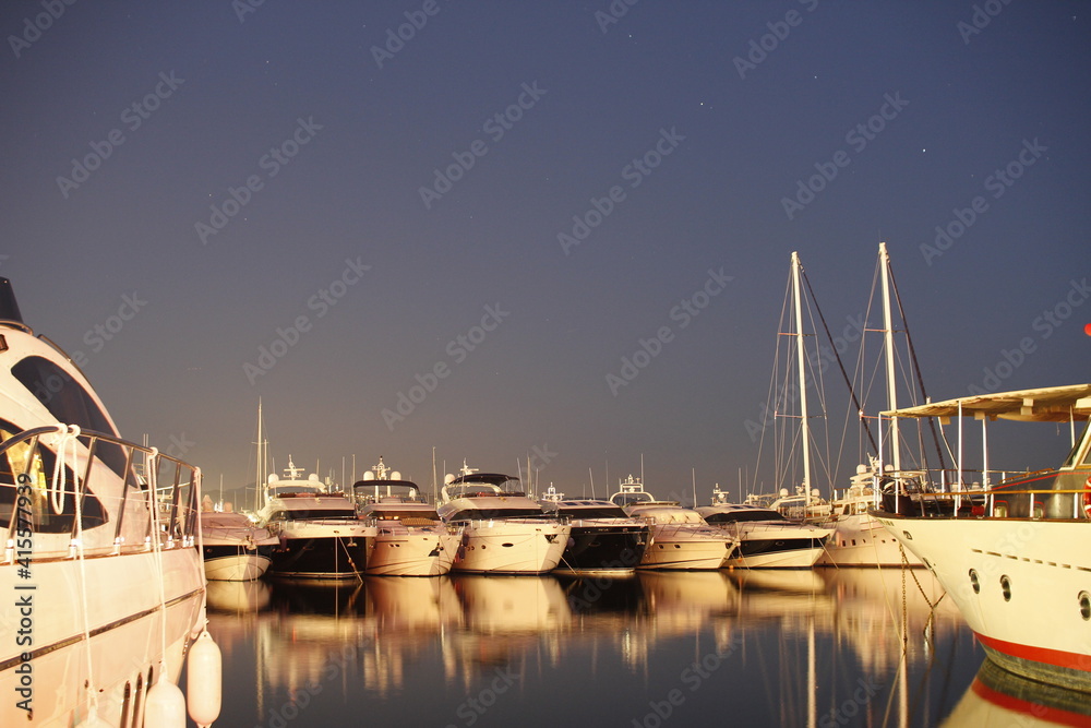 Luxury yachts and motor boats moored in Puerto Banus marina in Marbella, Spain. Marbella is a popular holiday destination located on the Costa del Sol in the southern Andalusia
