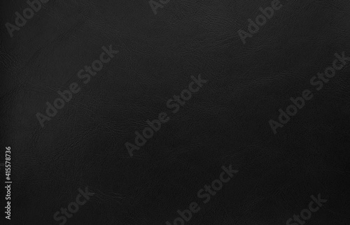 close up dark black leather texture background. abstract rustic concept background. top view of genuine leather.