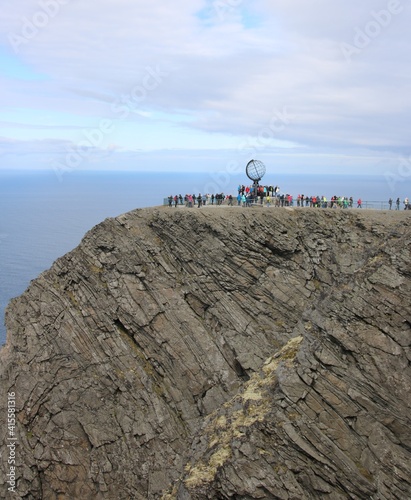 person on the top of the mountain at north cape