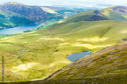 Track to mountain taking ranger path, North Wales, United Kingdom, view of the lake from the above, selective focus