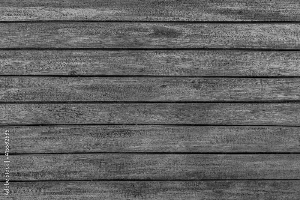 Texture of rural stained exterior brushed oak planks of country shed