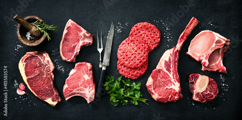 Schilderij op canvas Variety of raw cuts of meat, dry aged beef steaks and hamburger patties