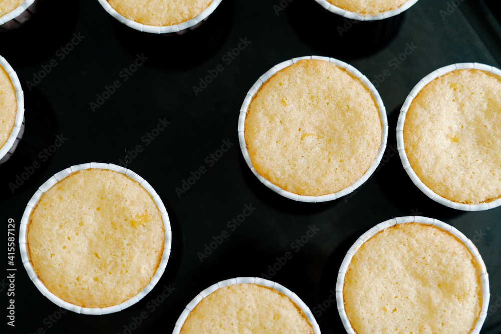freshly baked cupcakes on a black protvin background.Food for breakfast. Freshly baked cupcakes for dessert. Foodies and cuisine. freshly baked cupcakes on a black protvin background.Food for breakfast. Freshly baked cupcakes for dessert. Foodies and cuisine.