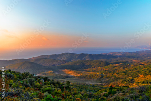sunrise over the hills and the sea in crimea on an autumn morning