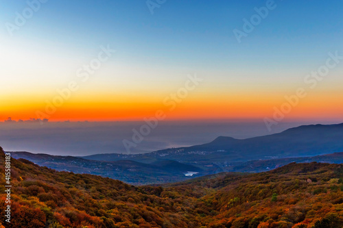 sunset over the hills and the sea in crimea on an autumn evening