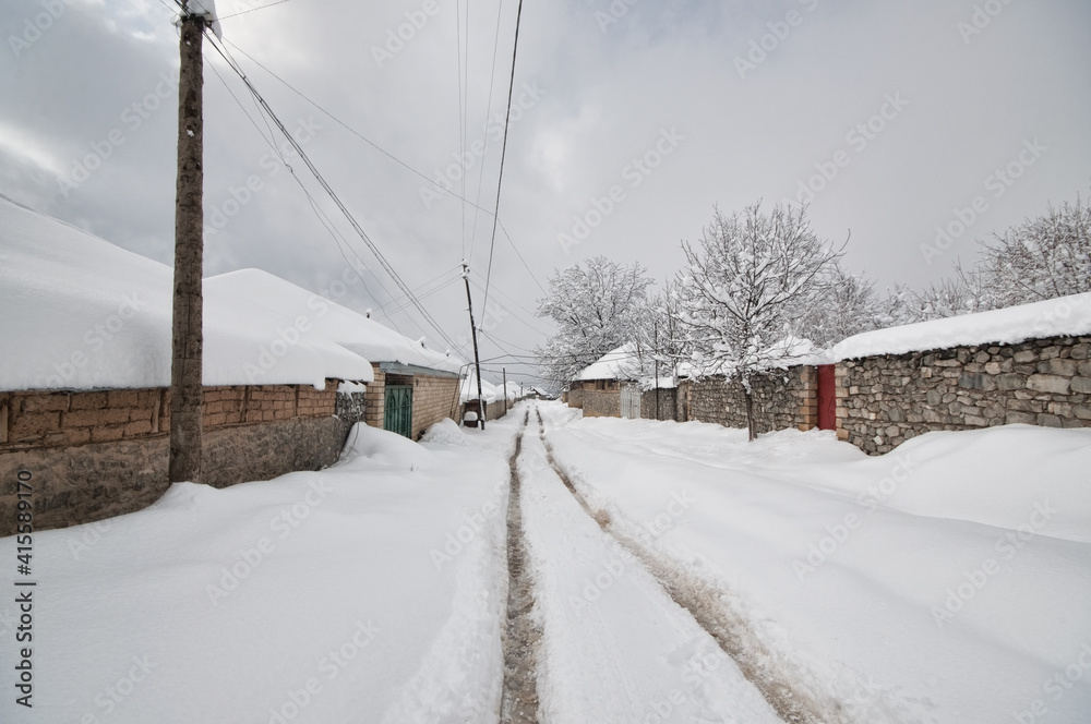 Obraz premium Winter mountain village landscape with snow and cute little houses, beautiful nature panoramic background