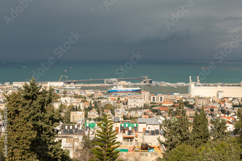 View on a rainy day from Mount Carmel to the downtown, the port and the Mediterranean Sea and Haifa city, in Israel. © svarshik
