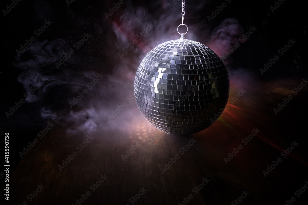 Obraz premium Colorful disco mirror ball lights night club background. Party lights disco ball. Selective focus