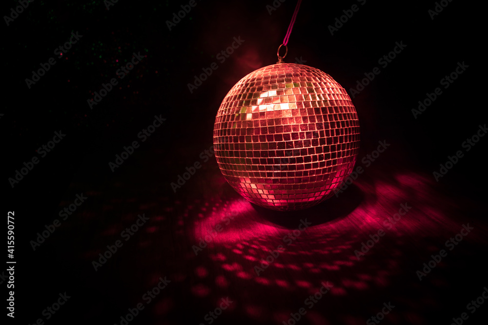 Obraz premium Colorful disco mirror ball lights night club background. Party lights disco ball. Selective focus