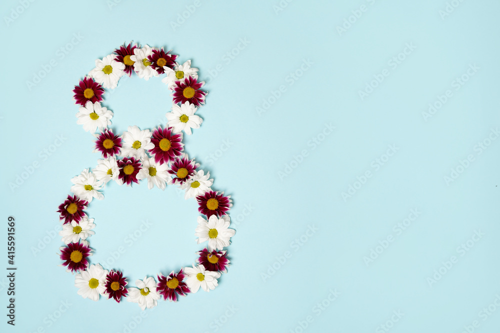 number 8 eight made from flowers on blue background with copy space