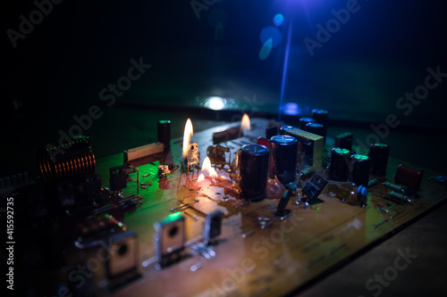 Burning microcircuit of complex electronic equipment. Factory breakdown concept.