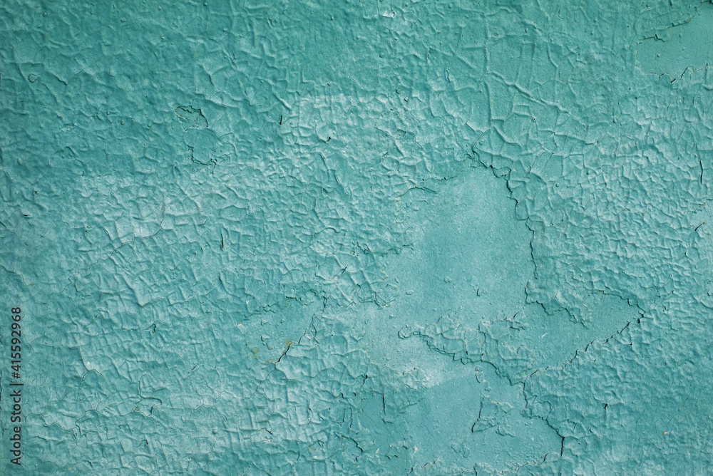 the texture of an old green painted wall. rough background. the texture of an old green painted wall. rough background.