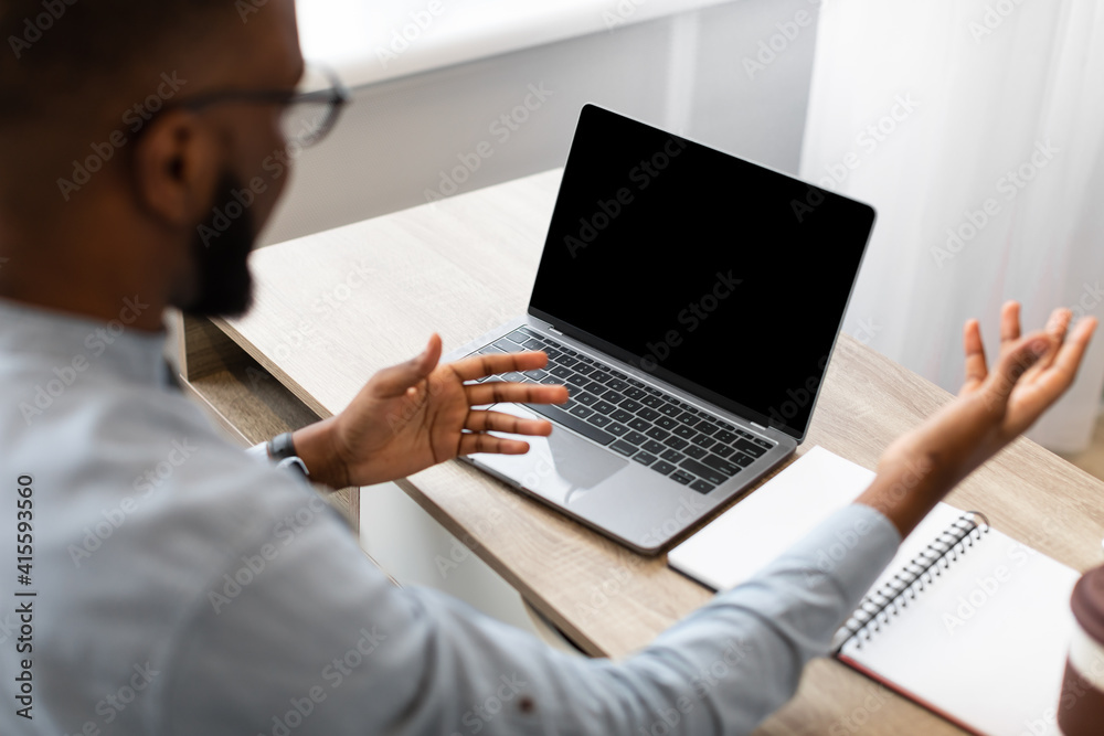 Black Businessman Having Video Call On Laptop In Office, Mockup Black Businessman Having Video Call On Laptop In Office, Mockup