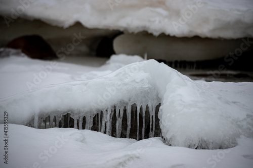  Ice formations at Baltic sea coast. Full of ice winter sea coast in Europe. Natural outdoor seascape with frozen ice formations. Ice covered Baltic sea coast. Frozen ice on a sunny day. Scenic view