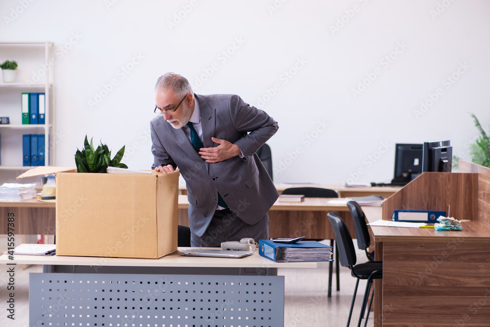 Old male employee being fired from his work Old male employee being fired from his work