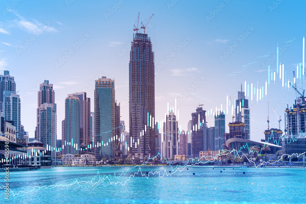 Fototapeta premium Skyscrapers of Dubai business downtown. International hub of trading and financial services of Western Asia. FOREX graph and chart concept. Double exposure. Dubai Canal waterfront.