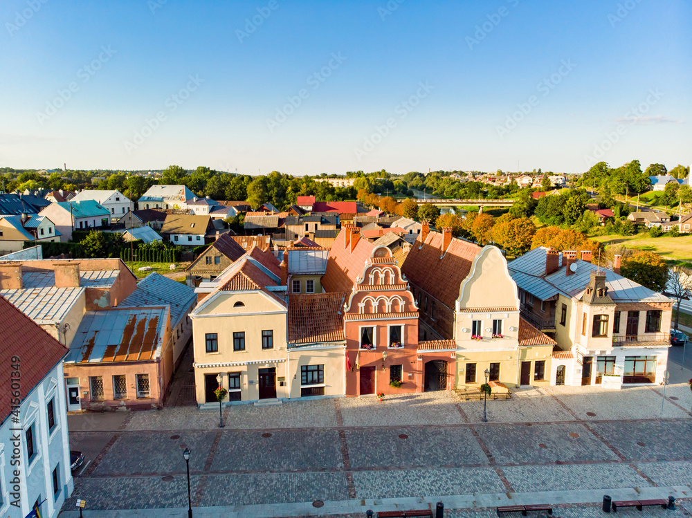 Obraz premium Beautiful aerial view of the market square of Kedainiai, one of the oldest cities in Lithuania. Unique colorful Stikliu houses in golden sunset light.