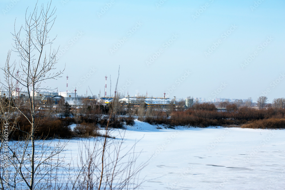 Snowy winter forest river scene. Landscape with trees. Trees along the shore. Winter landscape