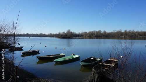 boats in the nature reserve Auer Koepfle-Illinger Altrhein-Motherner Woerth with the view of France, in the community Au am Rhein in the region Baden-Wuerttemberg in the month of February, Germany