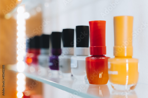 Varnishes of different colors on the shelf