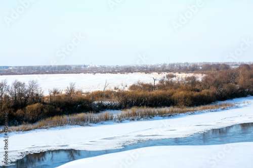 Wallpaper Mural Winter landscape of a forest lake. Beautiful winter landscape scene background with snowy trees and icy river. Frosty winter beauty Torontodigital.ca