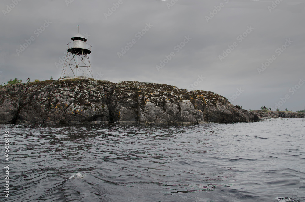 Lighthouse on the rocky shore Lighthouse on the rocky shore