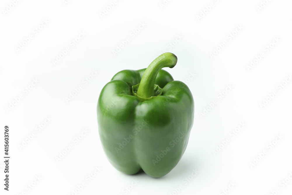 Closeup green bell pepper on a white background with copy space. Closeup green bell pepper on a white background with copy space.