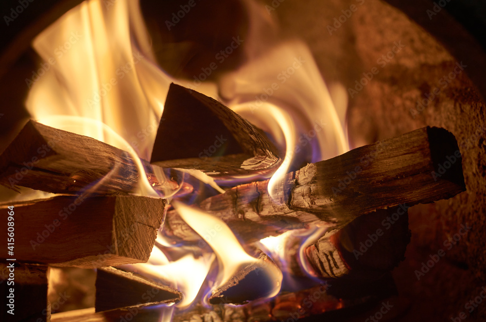 Fototapeta premium Firewood is burning in the stove