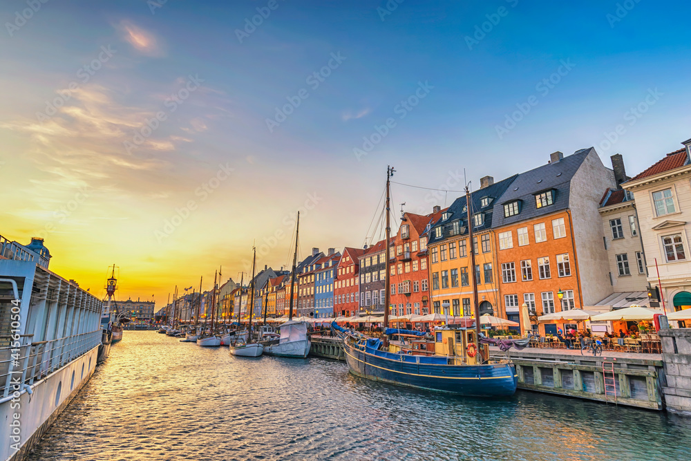 Copenhagen Denmark, sunset city skyline at Nyhavn harbour with colourful house