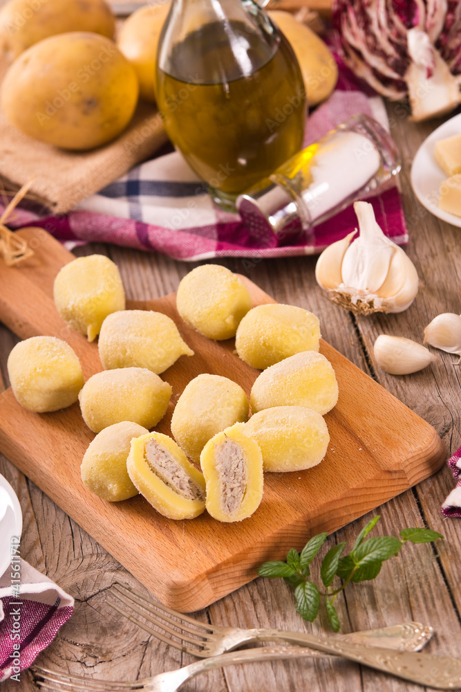 Potato gnocchi stuffed with radicchio and ricotta. 