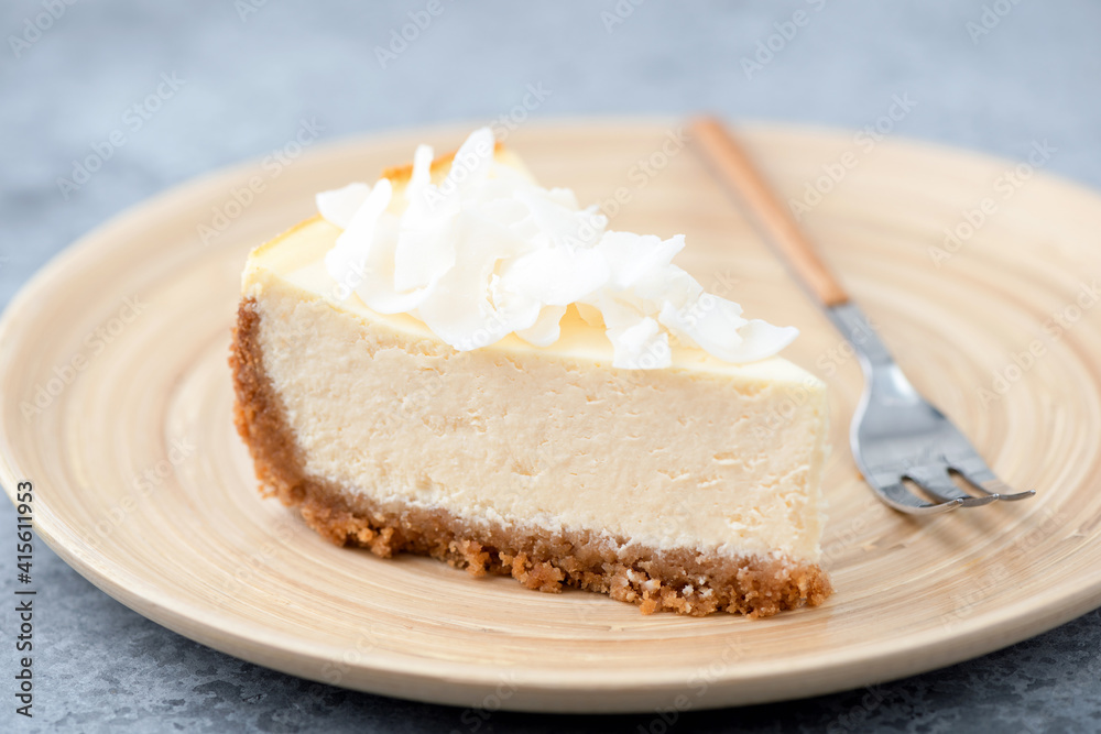 Vegan coconut cashew cheesecake on a bamboo plate. Healthy vegan pie Vegan coconut cashew cheesecake on a bamboo plate. Healthy vegan pie