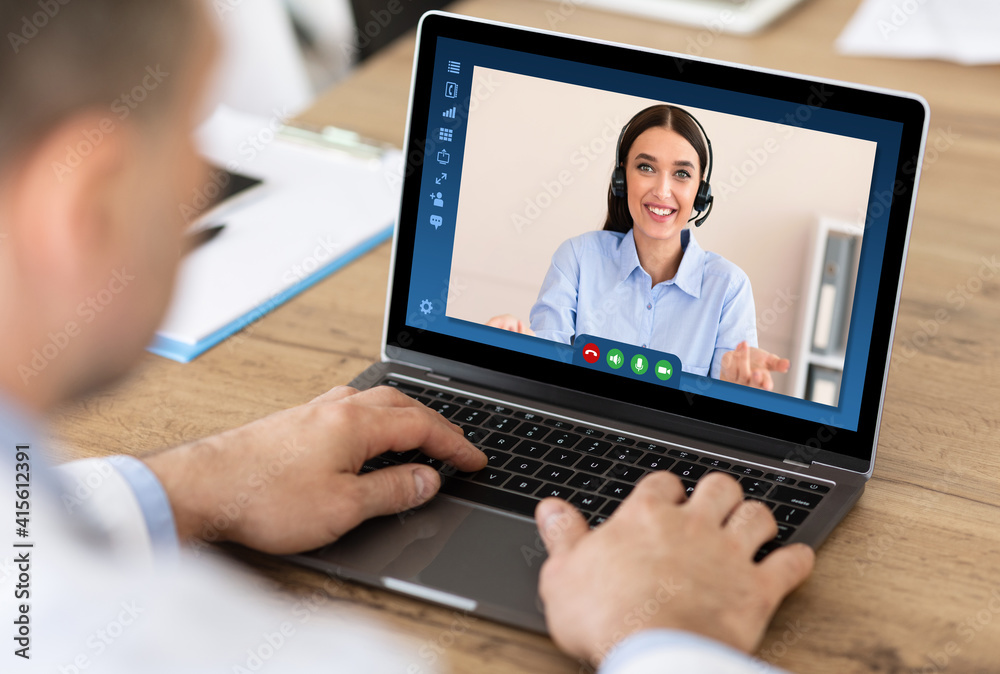Teleconference Concept. Businessman Talking With Female Manager Via Video Call On Laptop Teleconference Concept. Businessman Talking With Female Manager Via Video Call On Laptop