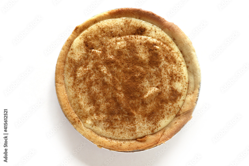 Traditional South African milk tart slice isolated on white background Traditional South African milk tart slice isolated on white background