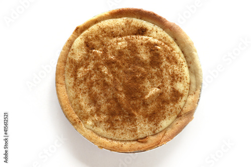 Traditional South African milk tart slice isolated on white background